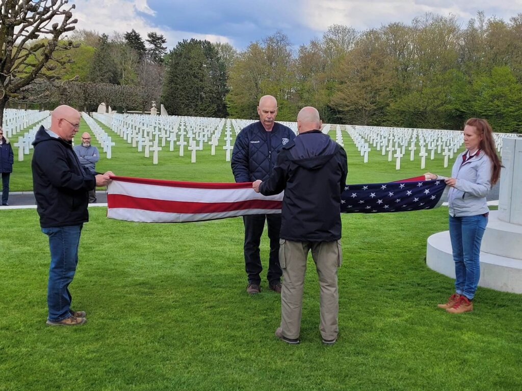 Participating in the flag lowering at an ABMC cemetery is a meaningful part of any battlefield tour.