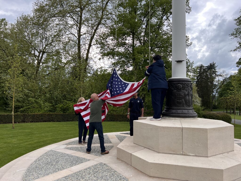 Tour testimonial in a picture. Participating in the flag-lowering ceremony at the Meuse-Argonne American Cemetery.