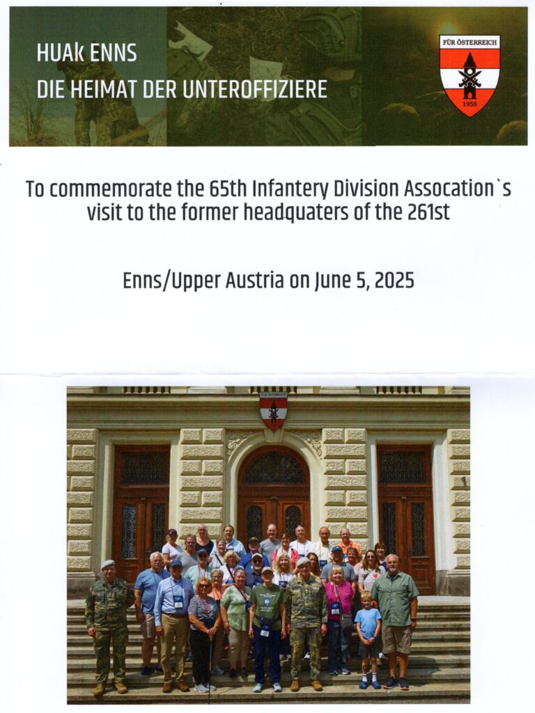 Tour participants standing where GIs of the 65th Infantry Division Association once stood at the Austrian NCO Academy in Linz, Austria.
