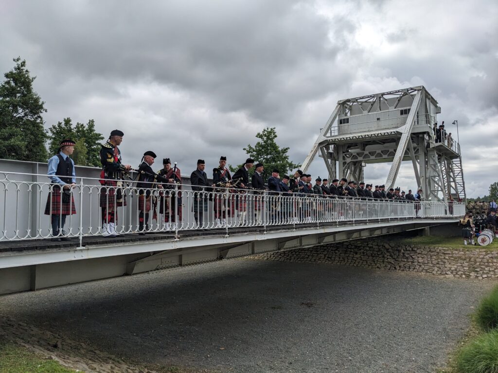 We also explore the airborne landings on the June 1944 Normandy Tour. Members of a pipe band on the original Pegasus Bridge during the 2024 80th Anniversary Commemoration
