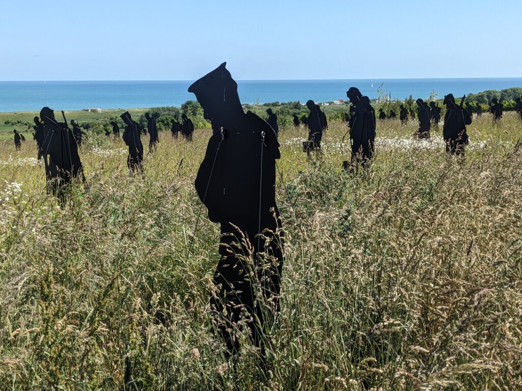Standing with Giants on Gold Beach, June 2024