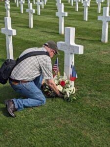John Decker laying a wreath at his great-uncle's grave in the Meuse-Argonne American Cemetery.